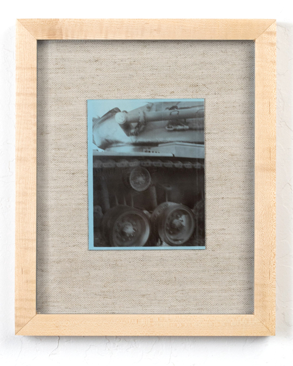 A blue dyed silver gelatin print of a machine.