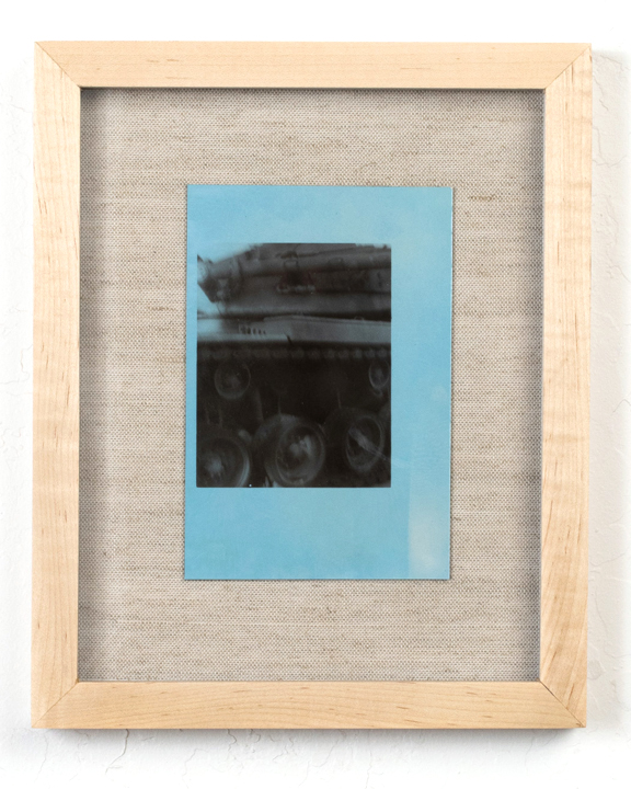 A blue dyed silver gelatin print of a machine.