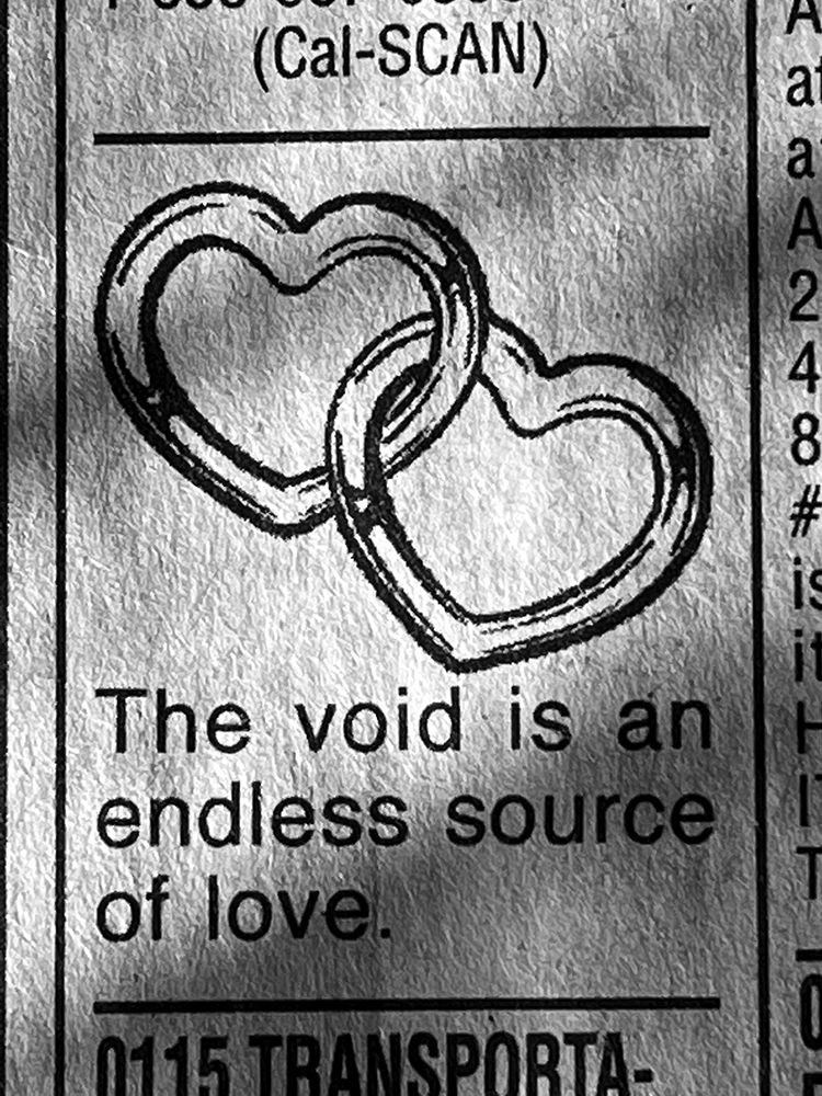 A classified ad featuring an image of interlocking hearts and text that reads The Void Is An Endless Source of Love.
